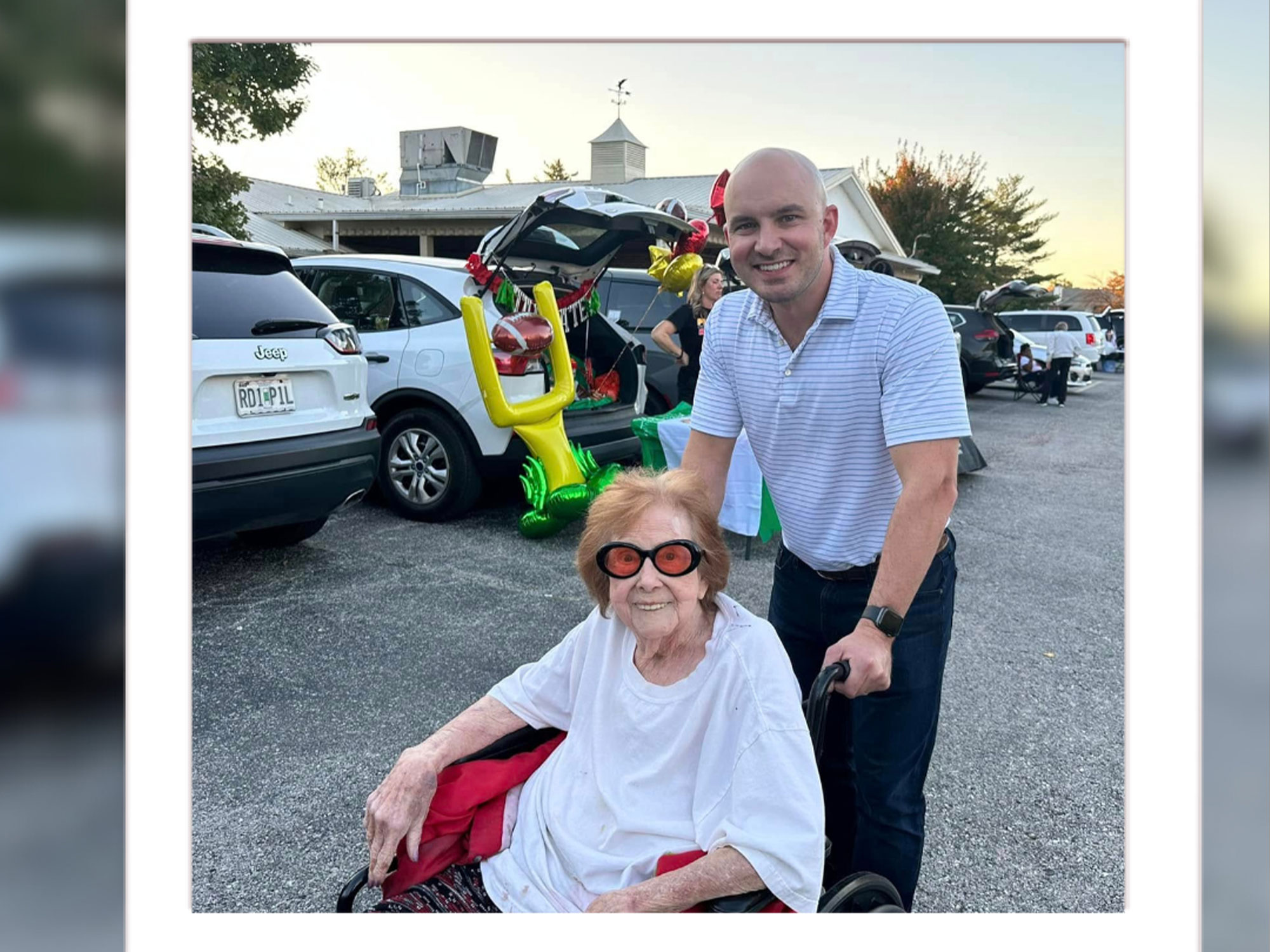A caregiver serving a meal to a resident